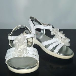 Adorable white baby sandals with flower detail